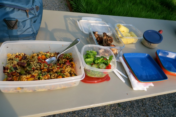 On the menu for the picnic, jerk chicken, corn on the cob, couscous with roasted vegetables, garden salad and strawberries with black bean brownies